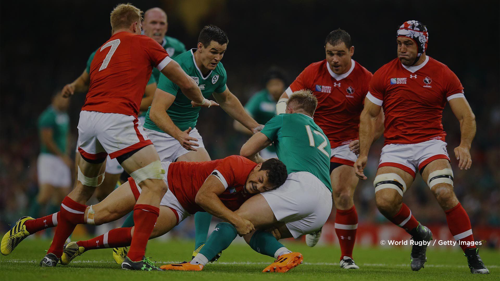 A Canadian player tackles an Irish player in a 2015 Rugby World Cup match. Photo by Richard Heathcote.